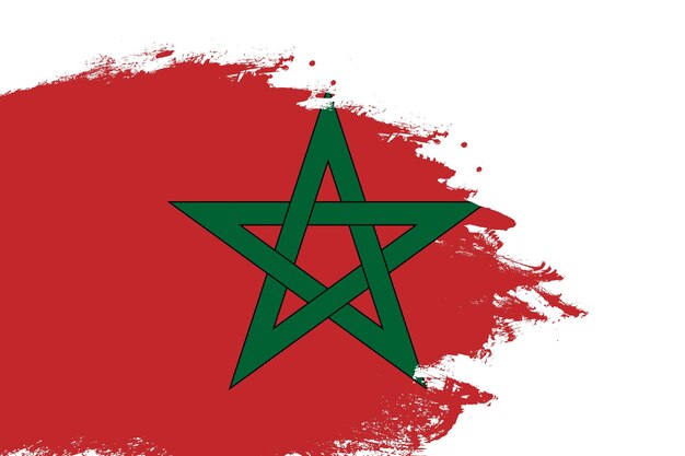 Photo morocco flag on a stained stroke brush painted isolated white background with copy space