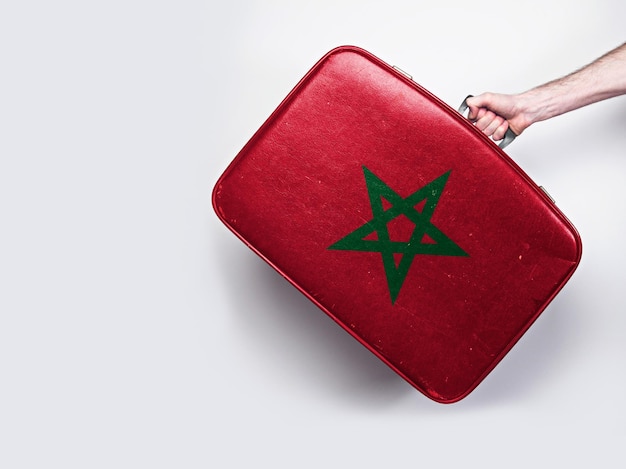 Morocco flag on a vintage leather suitcase