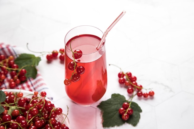 Morse of red currant berries on a light background