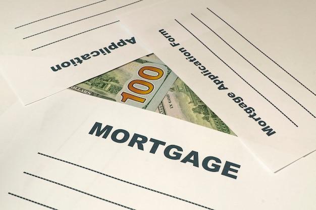 Mortgage application form with money on the table