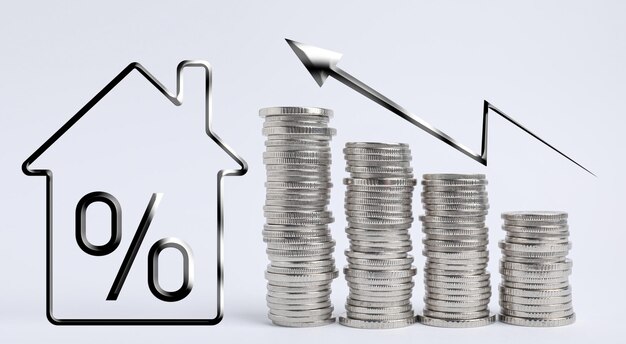 Mortgage concept Many stacked silver coins and house model on light background