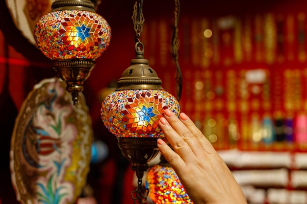 Mosaic colorful glass decorations lamps Travel tourism concept photo Colorful turkish lamts hanging on the roof indoor view