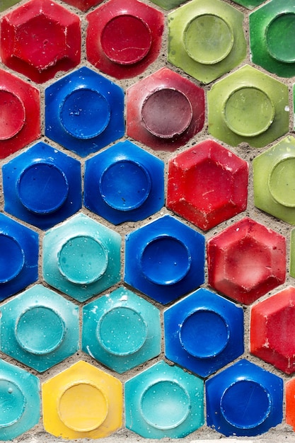 Mosaic of the Soviet period in the form of honeycombs on a concrete wall.