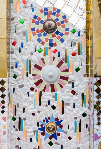 Mosaic wall from the old tile and old bowl.