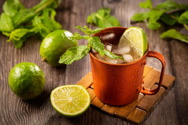 Moscow mule cocktail in copper mug on the table