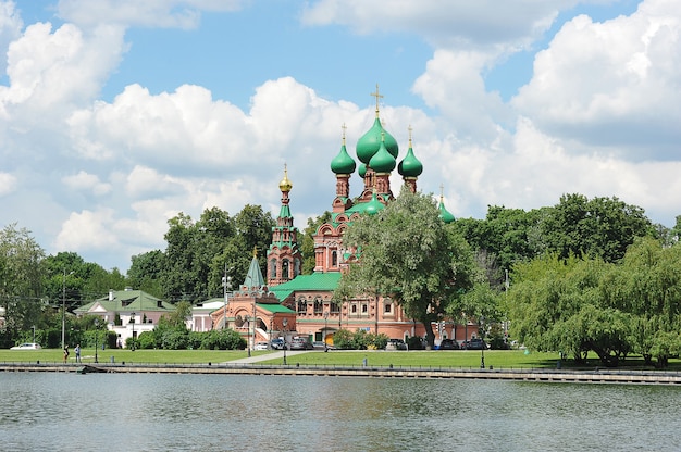 MOSCOW, RUSSIA - June 13, 2021: trinity Church on the bank of Ostankino pond in Moscow