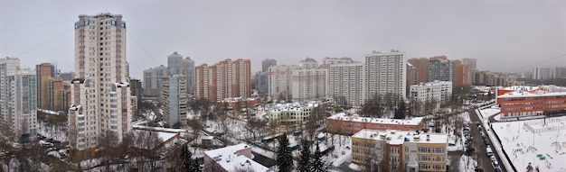 Moscow under snow, city landscape of residential district with high-rise, aerial view