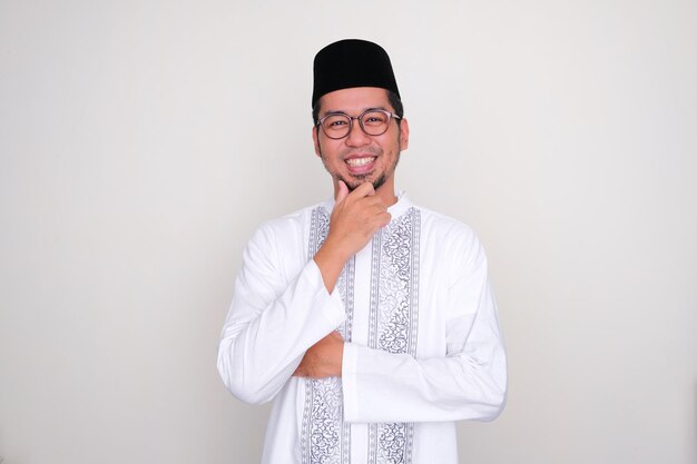 Moslem Asian man smiling confident at the camera