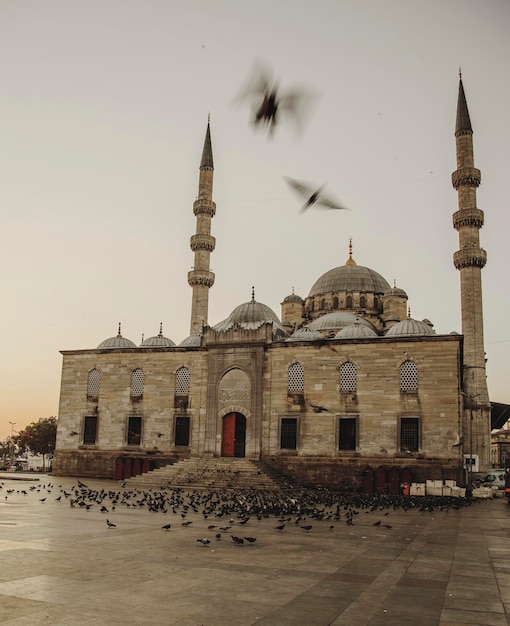 mosque against clear sky at sunset