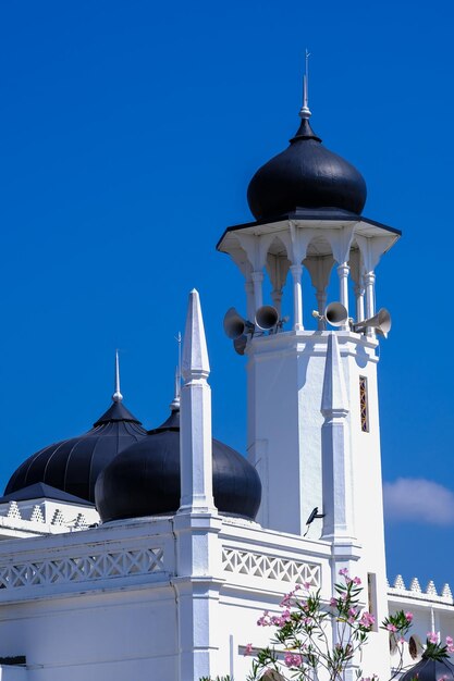 Mosque with sky blue background as a ramadhan and eid muslim concept