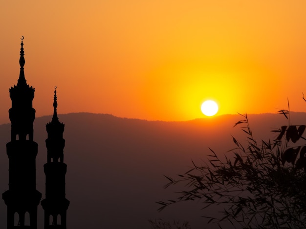 Mosques Dome on Sunset Twilight Sky with Shadow Leaves BackgroundIslamic New Year MuharramIslamic Religion Symbols Ramadan and ArabicEid alAdha Eid alfitrMubarakKareem Holy Muslim concept