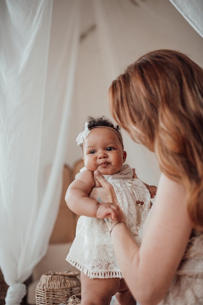mother and baby girl at home