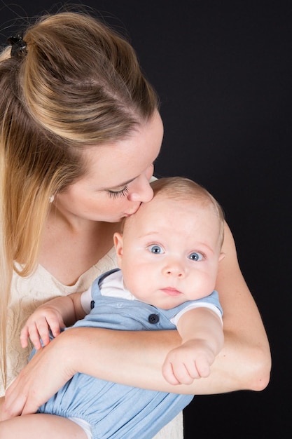 Mother and Baby kissing and hugging. Happy Family