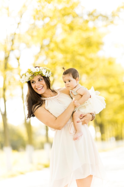 Mother and baby in the summer park