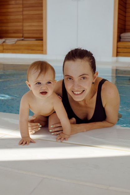 Mother and baby in swimming pool