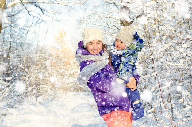 mother and baby in winter park