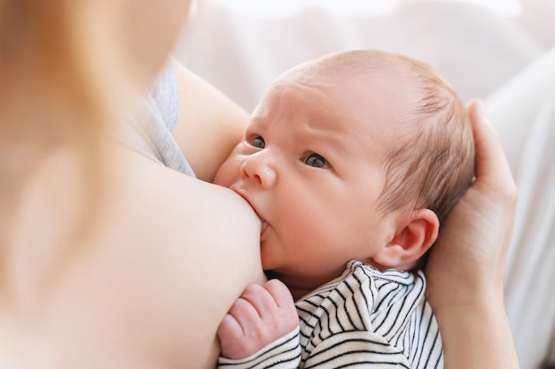 Mother breastfeeding baby Baby eating mothers milk