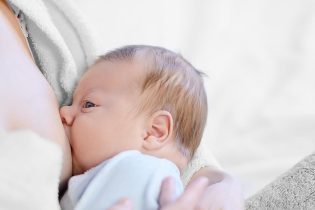 Mother breastfeeding her baby. Healthy lifestyle concept.