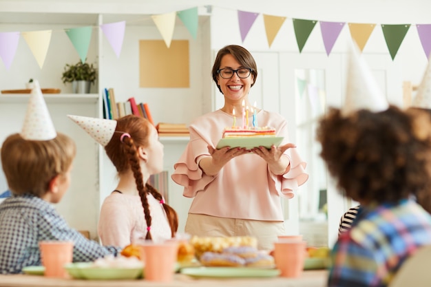 Mother Bringing Birthday Cake