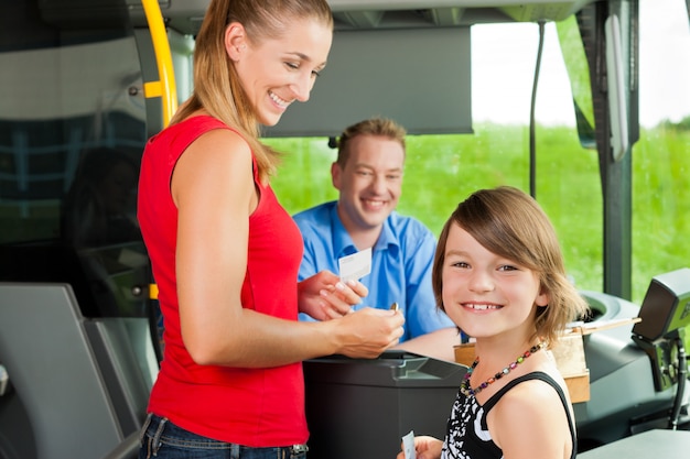 Mother and child boarding a bus