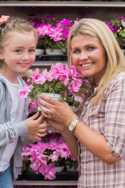 Mother and child holding a flower