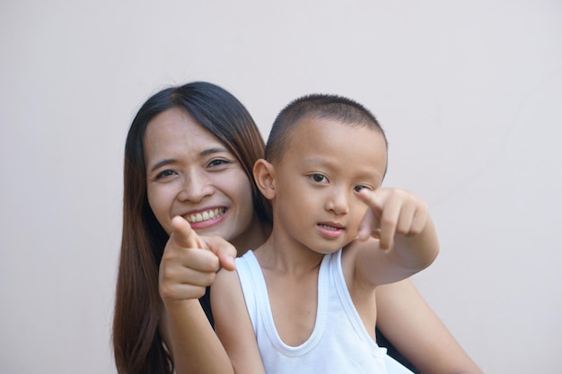 Mother and child smiling happily