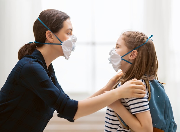 Mother and child wearing facemasks