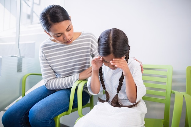 Mother consoling a daughter