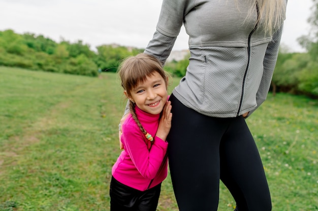 Mother and daughter 5 years old go in for sports in nature