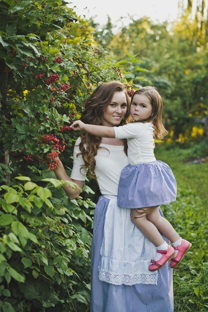 Mother and daughter are walking and playing in the garden 4724