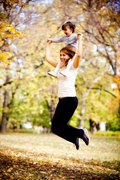 Mother an daughter in the autumn park