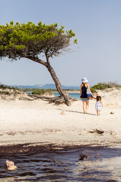 Mother and daughter on the beach