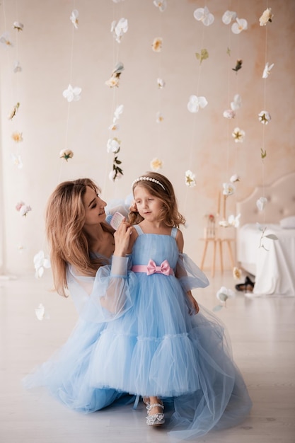 mother and daughter in blue dresses