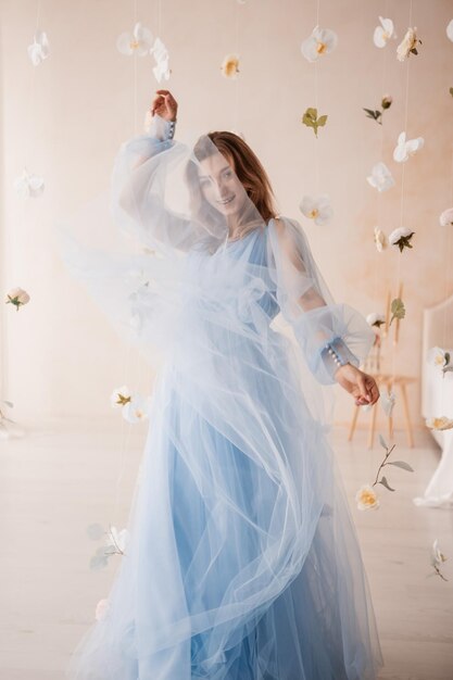 Photo mother and daughter in blue dresses