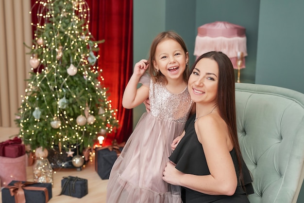 Mother and daughter celebrate new year as winter holidays concept