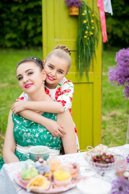 Mother and daughter cooking cupcakes