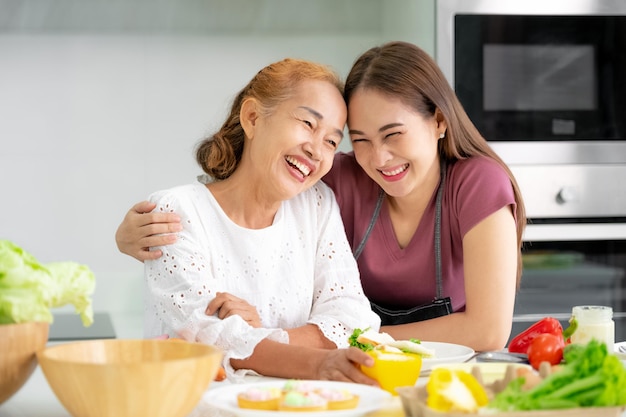 Mother and daughter cooking in the kitchen mother and daughter mother's day Asian family