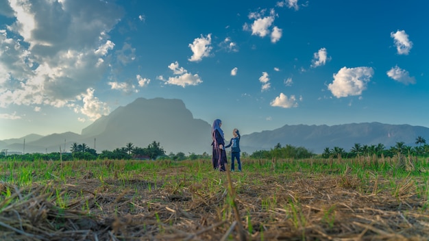 Mother And Daughter In Field