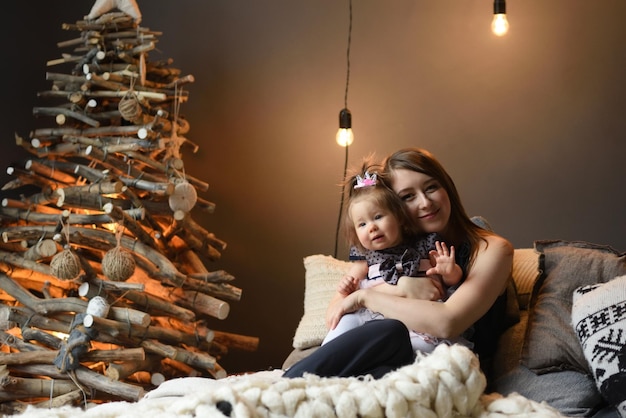 Mother and daughter have fun together before christmas