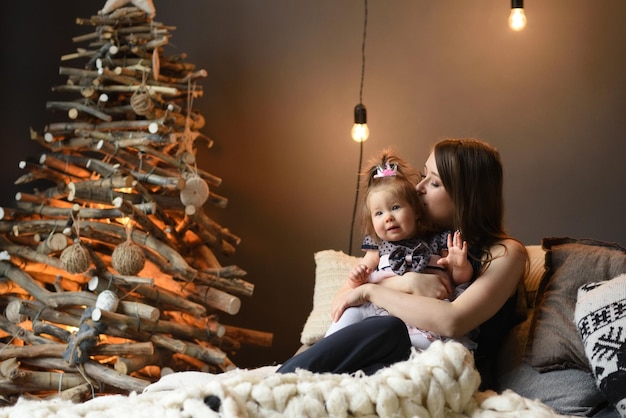 Mother and daughter have fun together before christmas