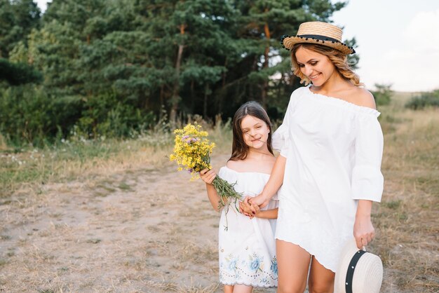 Mother and daughter having fun in the park