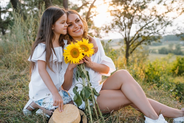 Mother and daughter having fun in the park