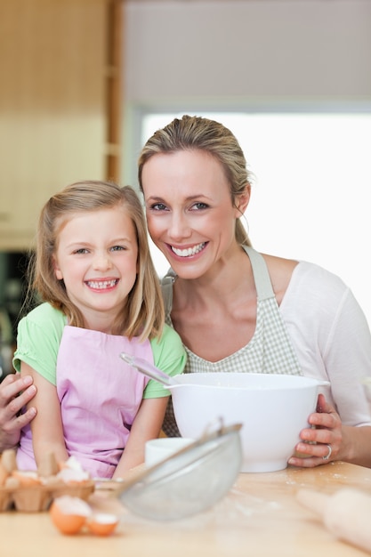 Mother and daughter having good time in the kitchen