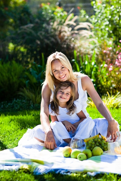 Mother and daughter having a picnic