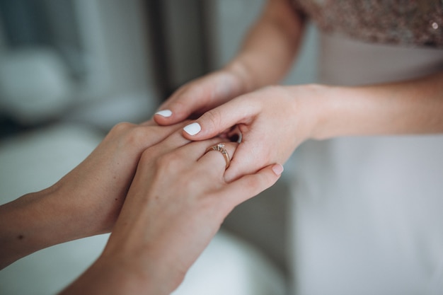 Mother and daughter holding hands