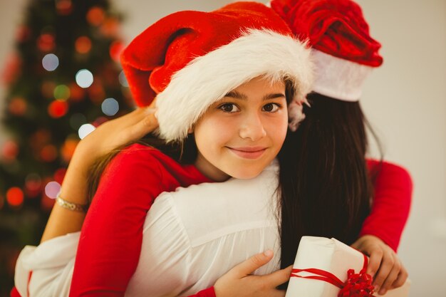 Mother and daughter hugging at christmas