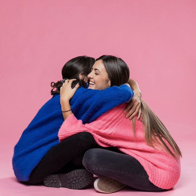 Mother and daughter hugging