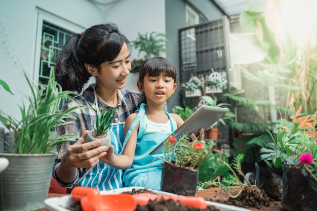 Mother and daughter learning about plants