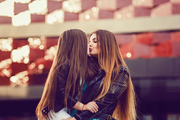 Mother and daughter in a leather jacket