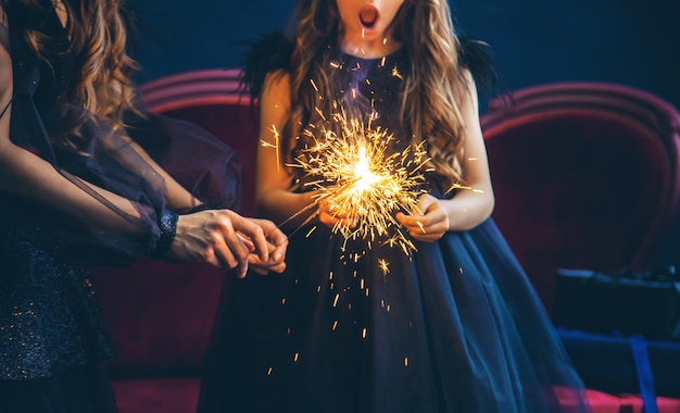 Mother and daughter lit sparklers on Christmas night.